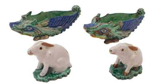 A pair of Majolica wild animal vases, profusely decorated in blue, green and brown, 22cm wide,...