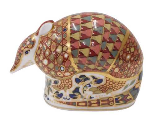 A Royal Crown Derby paperweight armadillo, silver stopper, 9cm high.