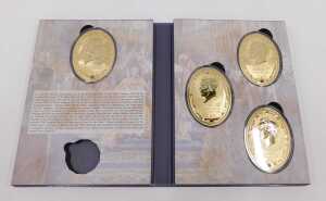 A Year of The Three Kings four piece gold plated medallion set, comprising portraits of George V,... - 2