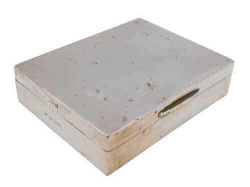 An Elizabeth II silver cigarette case, of plain rectangular form, with thumb mould handle and...