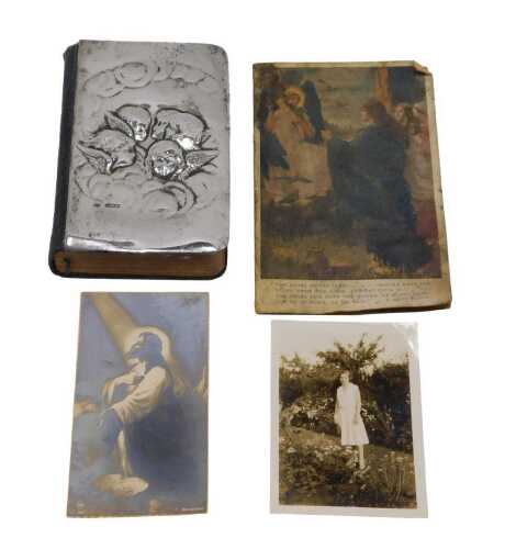 An Edward VII common prayer book, with silver cover, repousee decorated with angels, probably...