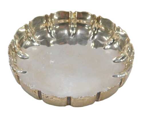 An Elizabeth II silver coaster, of floral form with flared rim, by Padgett & Braham Limited,...