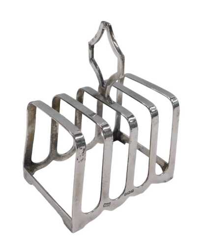 A George VI silver four sectional toast rack, with mitre shaped handle, by Walker & Hall,...