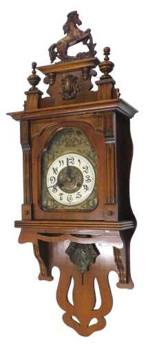 A late 19thC Junghans style Art Nouveau wall clock, the heavily carved case surmounted by...