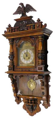 An early 20thC German walnut cased compact wall clock, the 16cm diameter Arabic silvered chapter...