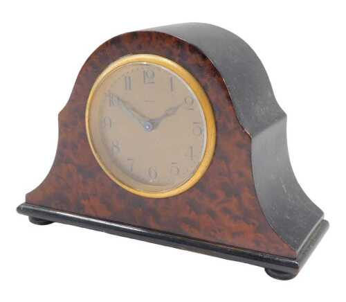 An early 20thC burr walnut and ebonised cased mantel clock, the 7cm diameter Arabic dial, in a...