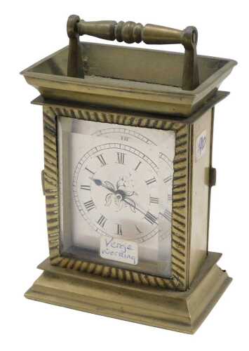 A miniature early 20thC brass travel carriage clock, in brass case with silvered 5cm wide Roman...