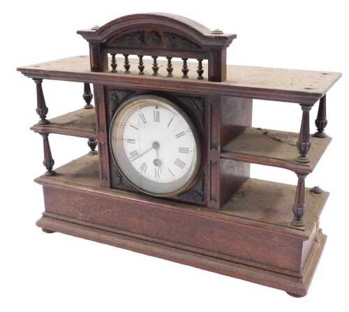 An unusual 19thC mantel clock cabinet, the central 11cm diameter Roman numeric dial revealing a...