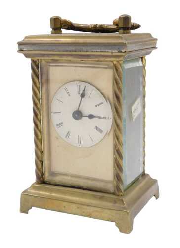 An early 20thC brass carriage or travel clock, of rectangular form with 5cm diameter Roman...