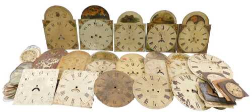 A large quantity of longcase clock parts, arched dials, various other glass sections, mantel...