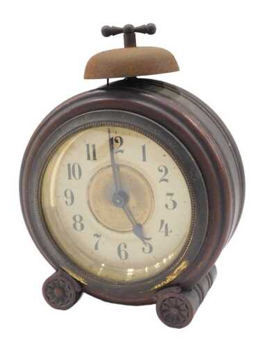 An early 20thC Junghans travel alarm clock, with 11cm diameter Arabic dial, in shaped circular...