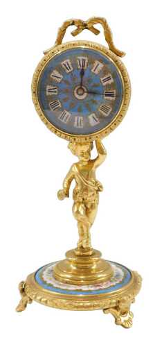 A Louis XVI style ormolu table clock, of small proportion, the 5cm diameter fancy enamel Roman...