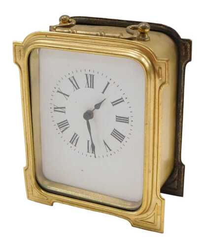 A 20thC brass travel or carriage clock, the 8cm wide backplate with Roman numeric dial, in a...
