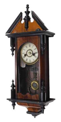 An early 20thC small sized walnut and ebonised Vienna style wall clock, with 8cm diameter Roman...