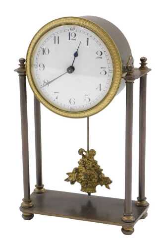 A late 19thC French brass mantel clock, with 8cm diameter enamel Arabic dial, on turned supports...