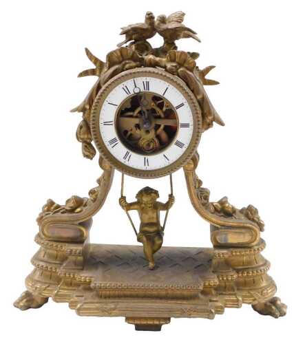 A 19thC French gilt metal mantel clock, the 9cm diameter Roman numeric enamel dial centred by...