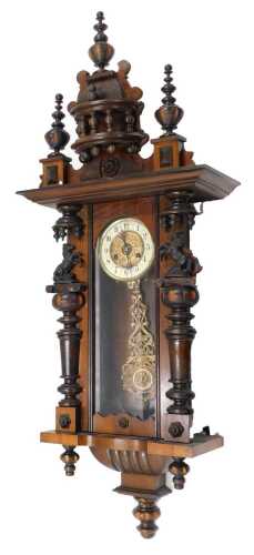 A 19thC walnut cased Vienna wall clock, with fancy 14cm diameter Arabic dial, visible pendulum,...