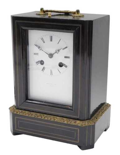A 19thC mantel or travel clock, with ebonised case, gilt metal swing handle and embellishments,...