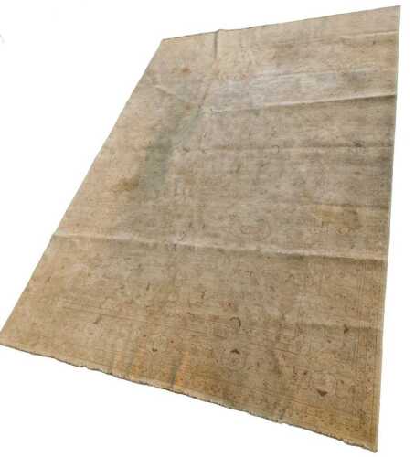 A 20thC Pakistan wool pile rug, in floral geometric pattern, 393cm x 287cm, hand written cost...