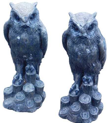 Two owl garden statues.
