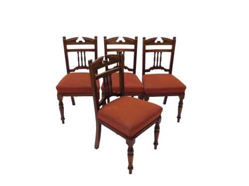 A set of four Edwardian dining chairs, each of classical design, with overstuffed seats, on...