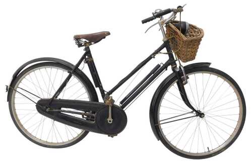 A mid 20thC vintage lady's Raleigh The All Steel bicycle, with front basket and dynamo, and...