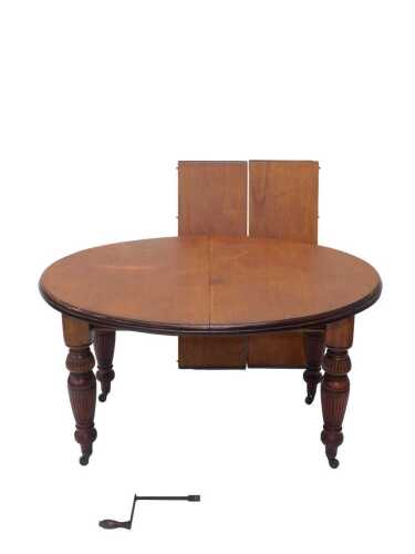 A 19thC D end extending wind out dining table, with plain top, on heavy turned legs terminating...