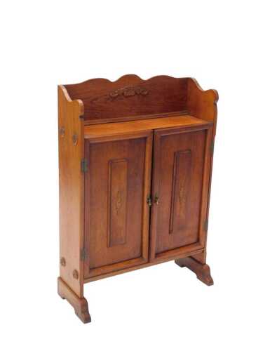 A late 19thC oak cupboard, with serpentine three-part galleried back raised above two panelled...