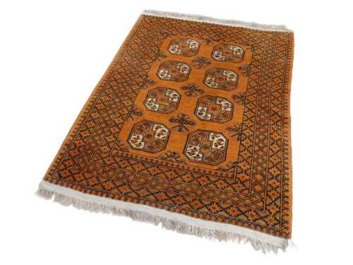 An Afghan Nahzat style wool pile rug, in geometric pattern on a brown ground, 183cm x 142cm,...