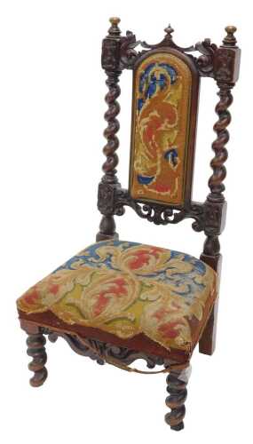 A 19thC walnut Carolean style chair, with arched petit point back and overstuffed seat, with...