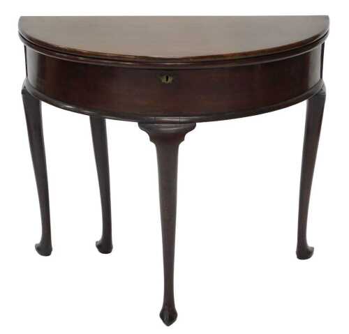 A 19thC fold over D end tea table, with lock, on turned legs terminating in hoof feet, when...
