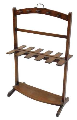 An early 20thC mahogany whip and boot hall stand, centred by a fixed metal handle, with turned...