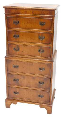 A 20thC miniature chest on chest, the upper section with three cock beaded drawers, with pierced...