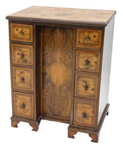 A principally late 19thC walnut kneehole desk, the quarter veneered top raised above central...