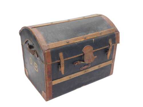 A late 19thC pressed leather and wicker dome topped trunk, with leather side carrying handles,...