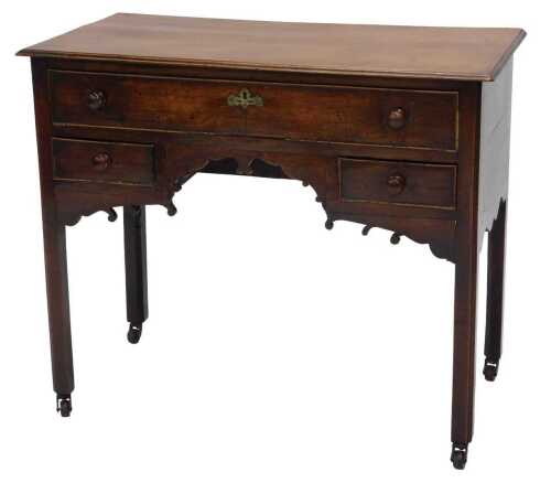 A principally early 19thC oak desk or low boy, of rectangular form with one long and two short...