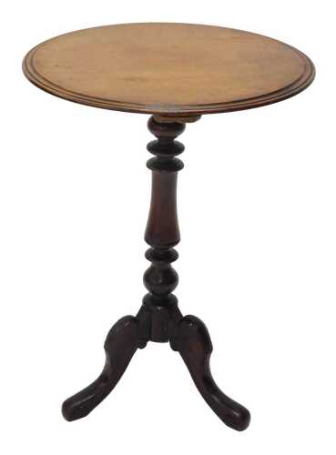 A 19thC mahogany and walnut tripod occasional table, the plain circular moulded top, raised on...