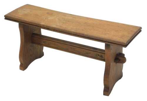 An early 20thC elm bench, of small proportion, the rectangular top on shaped stiles, 40cm high,...