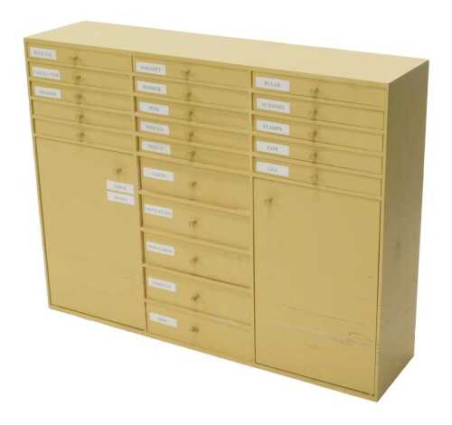 A lightwood tool cabinet or chest, painted cream, with various drawers and cupboards, 80cm high,...