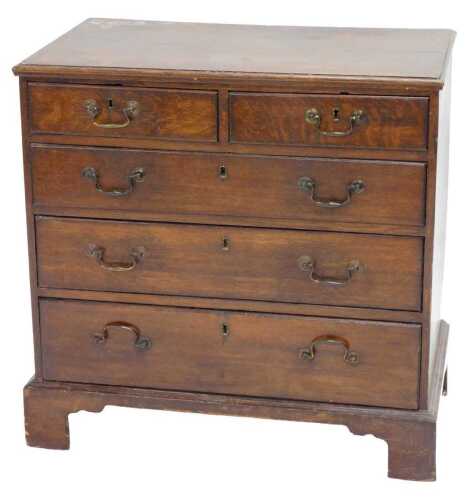 An 18thC oak chest of two short and three long drawers, with swan neck handles on bracket feet,...