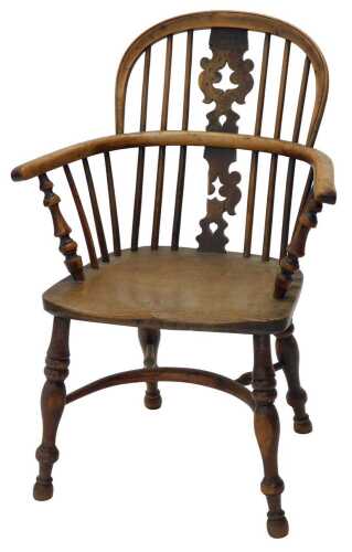 A 19thC yew wood low back Windsor chair, with Retford Christmas tree splat, shaped seat and...