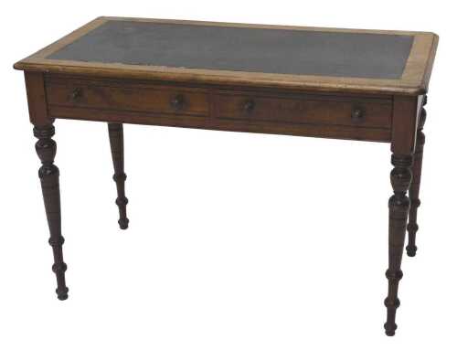 A late 19thC writing desk, with one piece leather top raised above two frieze drawers on turned...