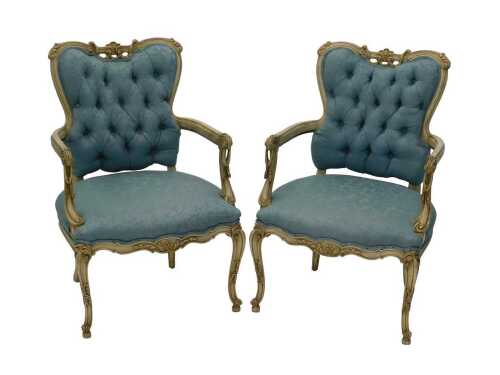 A pair of late 20thC French salon chairs, in late 19thC style, each with overstuffed backs and...