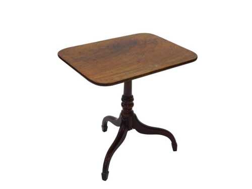 An early 19thC mahogany tilt top occasional table, the oblong top on a cylindrical stem...