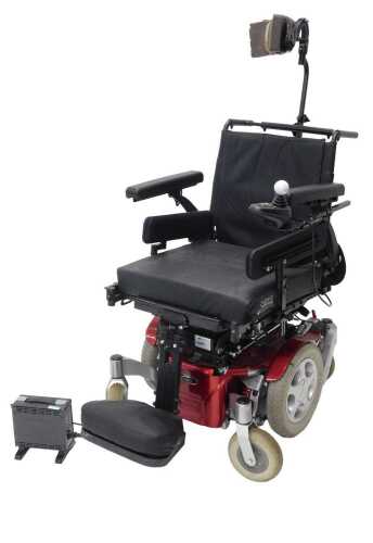 A Quickie electric mobility wheelchair, in red and black trim, with golf ball accelerator and...