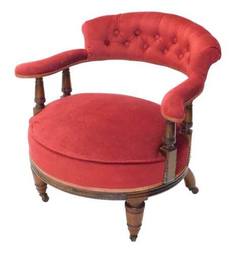 A late 19thC mahogany framed tub chair, with overstuffed back arms and oval seat, on compressed...