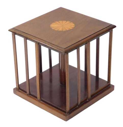 A Sheraton Revival mahogany and inlaid tabletop revolving bookcase, of square form, set with sun...