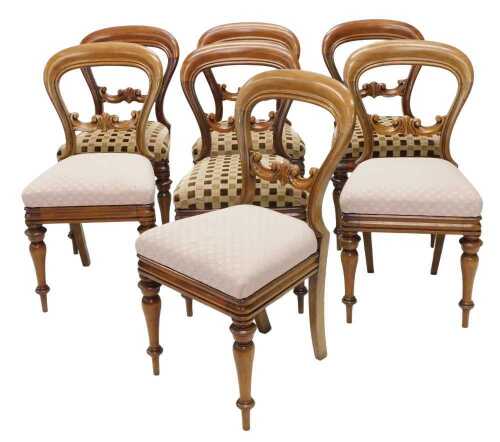 A matched set of seven Victorian mahogany balloon back dining chairs, each with horizontal...