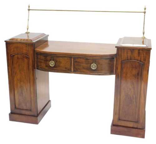 A 19thC mahogany sideboard, the D end centre with two curved drawers, with ring back handles,...