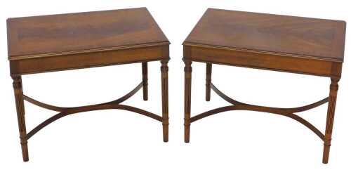 A pair of Victorian style flame mahogany finish rectangular side tables, each with a wide cross...